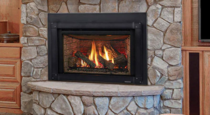 A rustic gas fireplace insert in a stone face fireplace within a cozy, rustic den, requiring annual chimney liner safety maintenance.
