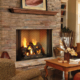 A modern gas fireplace insert installed in a classic living room setting, requiring an annual propane safety check.